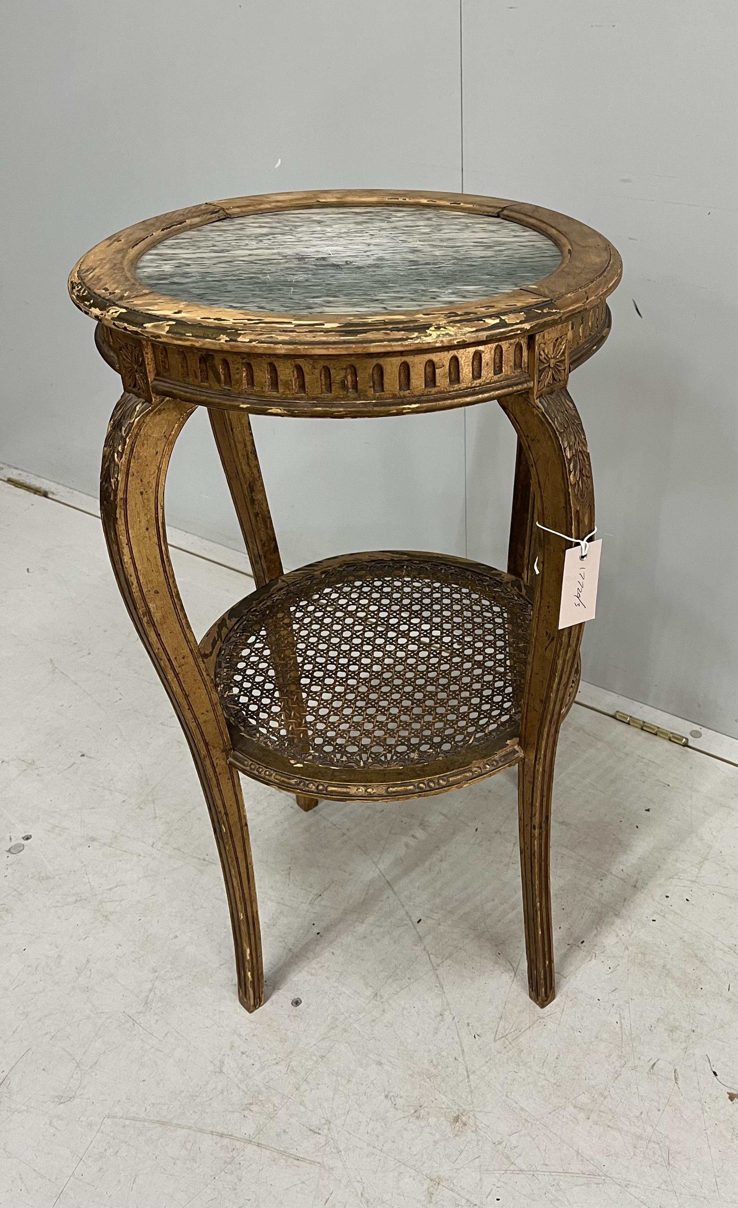 A late 19th century French circular marble topped giltwood two tier table with caned undertier, diameter 46cm, height 75cm. Condition - poor to fair
